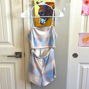 Baby blue/ pink romper. Stomach does show but def cute for a chill day 😁